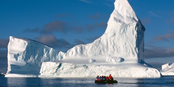 Antarctica - Wedell Sea - Oceanwide - Zodiac with huge iceberg by Rinie van Meurs